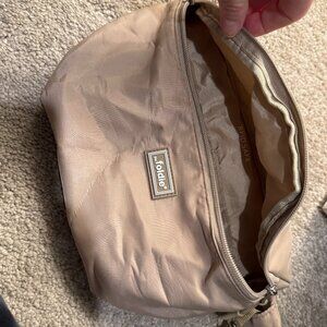 Foldie cream colored cross body bag